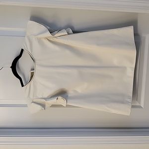 Cute "pleather" top with ruffled shirt sleeves